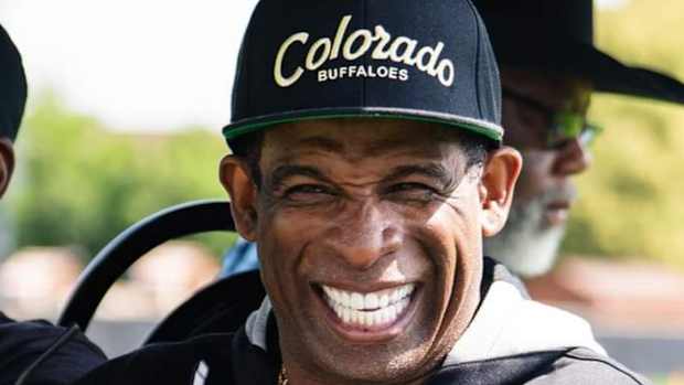 Deion Sanders smiling at CU Fall Camp